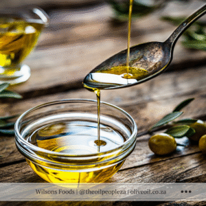 Pouring extra virgin olive oil from bottle